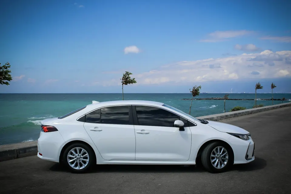 White Toyota Corolla saloon car for hire in Accra